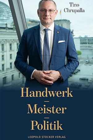 Book cover for Handwerk Meister Politik by Tino Chrupalla, featuring a man in a blue suit standing by a window with a cityscape in the background.
